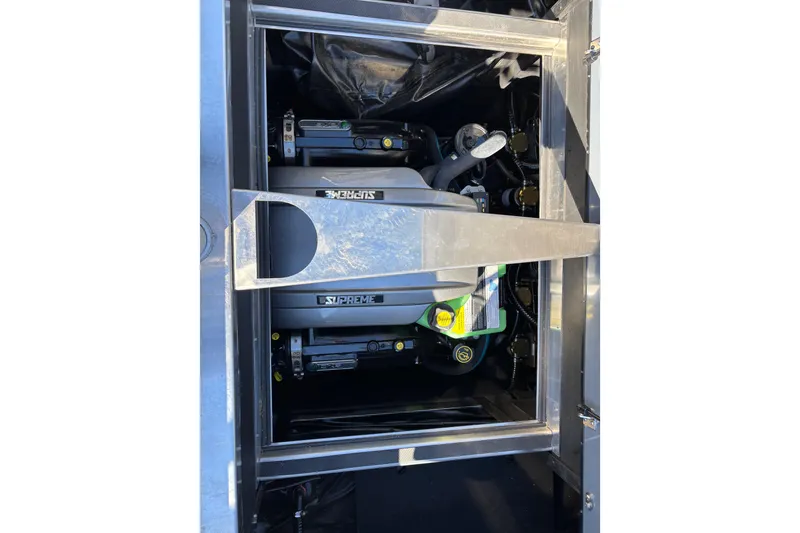 Slide: The Image of 2023 Supreme ZS232 engine compartment with visible components and branding. - 14