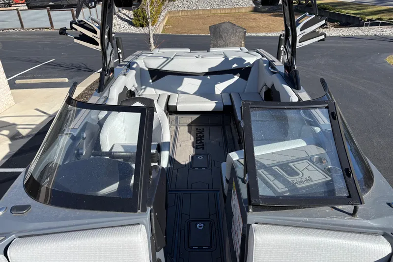 Slide: The Image of 2023 Supreme ZS232 boat interior with open windshield and seating. - 7