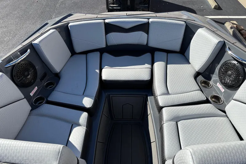 Slide: The Image of 2023 Supreme ZS232 boat interior with gray seating and built-in speakers. - 8