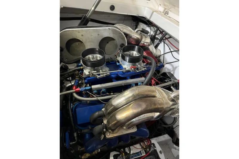 Slide: The Image of Engine of a 1992 Fountain 27 Fever boat, featuring dual carburetors and polished exhaust headers. - 5