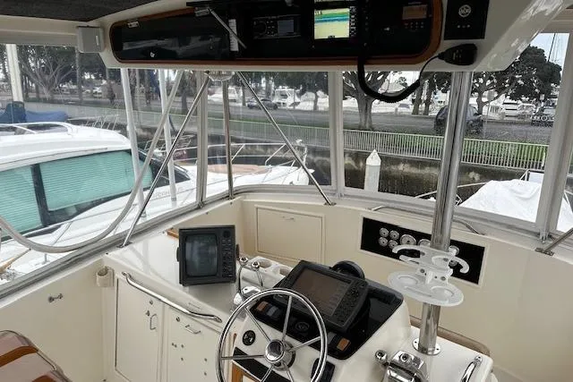 Slide: The Image of Cockpit of 1988 Ocean 44' Super Sport yacht with navigation equipment and steering wheel. - 15