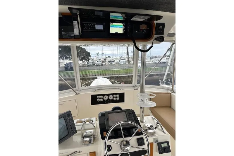 Slide: The Image of Interior view of 1988 Ocean 44' Super Sport yacht cockpit with navigation equipment. - 17