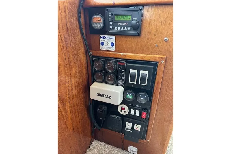 Slide: The Image of Control panel of a 1988 Ocean 44' Super Sport yacht with various gauges and switches. - 21