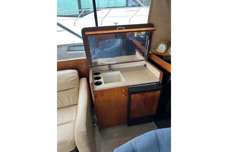 Slide: The Image of 1988 Ocean 44' Super Sport yacht interior with sink and mini-fridge. - 23