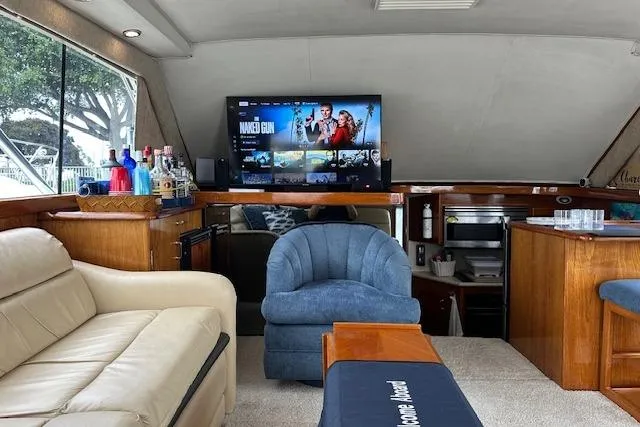 Slide: The Image of Luxurious interior of 1988 Ocean 44' Super Sport yacht with modern entertainment setup. - 25