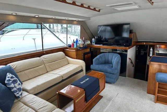 Slide: The Image of Luxurious interior of 1988 Ocean 44' Super Sport yacht with plush seating and modern amenities. - 26