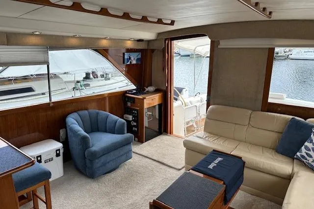 Slide: The Image of Interior of 1988 Ocean 44' Super Sport yacht with cozy seating and waterfront view. - 30