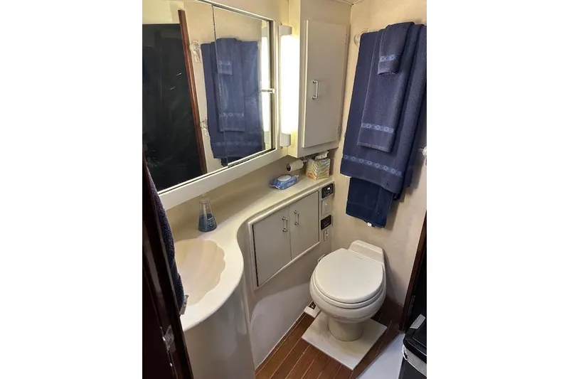 Slide: The Image of Bathroom interior of 1988 Ocean 44' Super Sport yacht with towels and toiletries. - 41