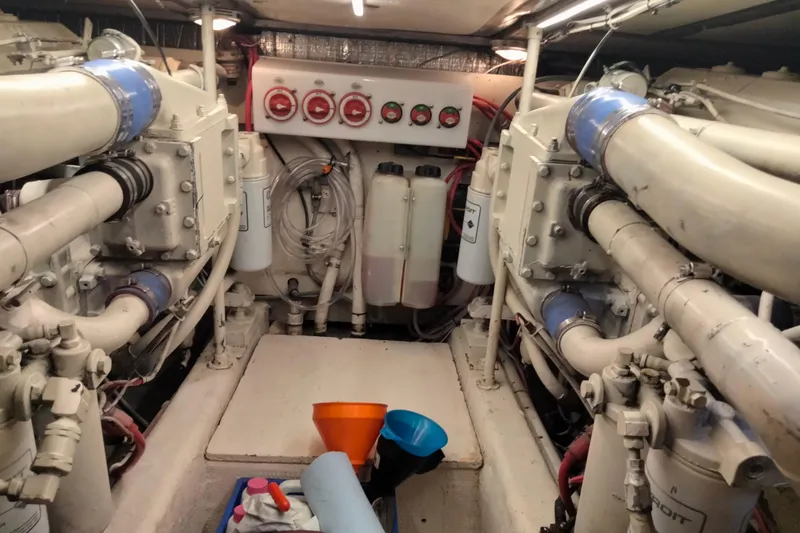 Slide: The Image of Engine room of 1988 Ocean 44' Super Sport yacht with visible machinery and equipment. - 42