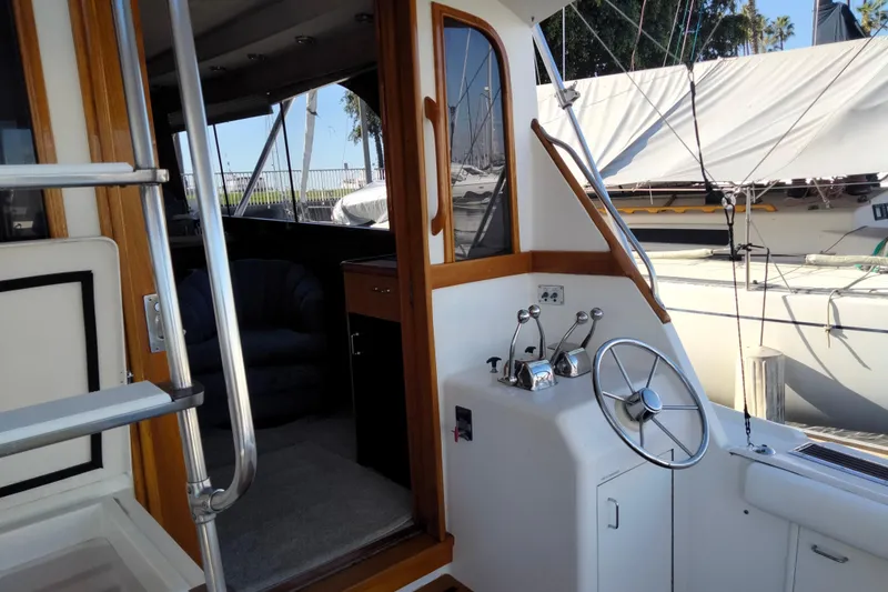 Slide: The Image of 1988 Ocean 44' Super Sport yacht interior with helm and seating area. - 6