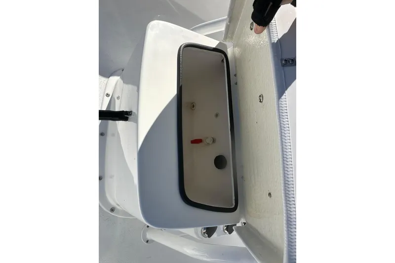 Slide: The Image of Open storage compartment on 2026 Action Craft 24 Bay boat. - 22