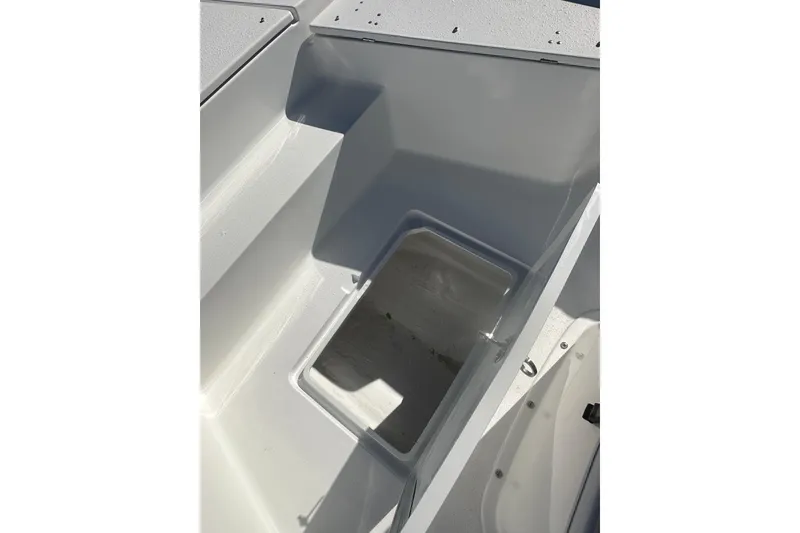 Slide: The Image of 2026 Action Craft 24 Bay boat storage compartment, open and empty. - 23