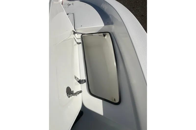 Slide: The Image of 2026 Action Craft 24 Bay boat storage compartment, open and empty. - 24