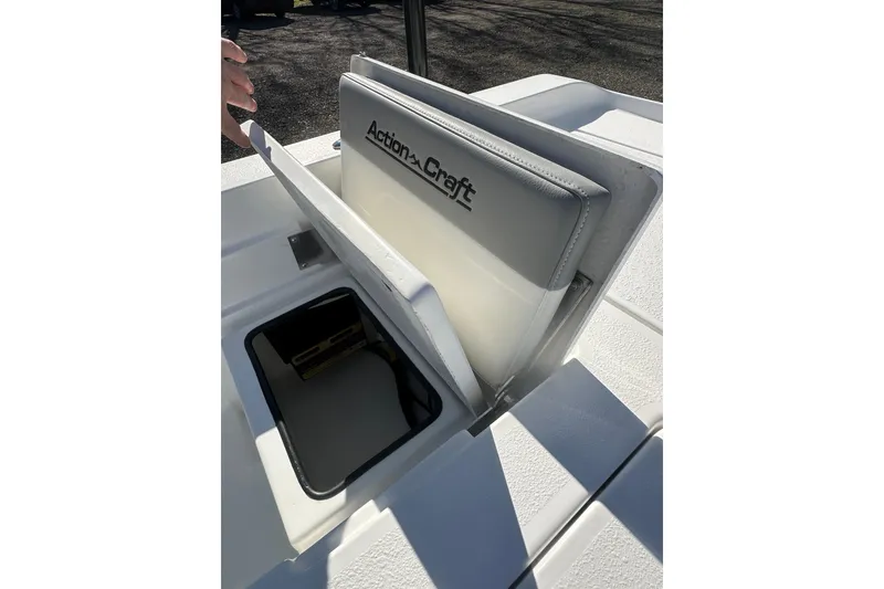 Slide: The Image of 2026 Action Craft 24 Bay boat seat and storage compartment detail. - 33