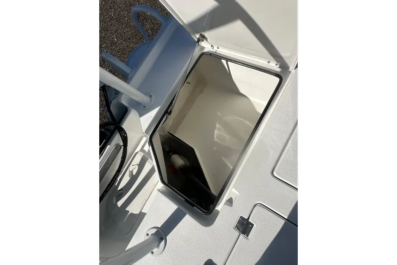 Slide: The Image of Open storage compartment on 2026 Action Craft 24 Bay boat deck. - 15