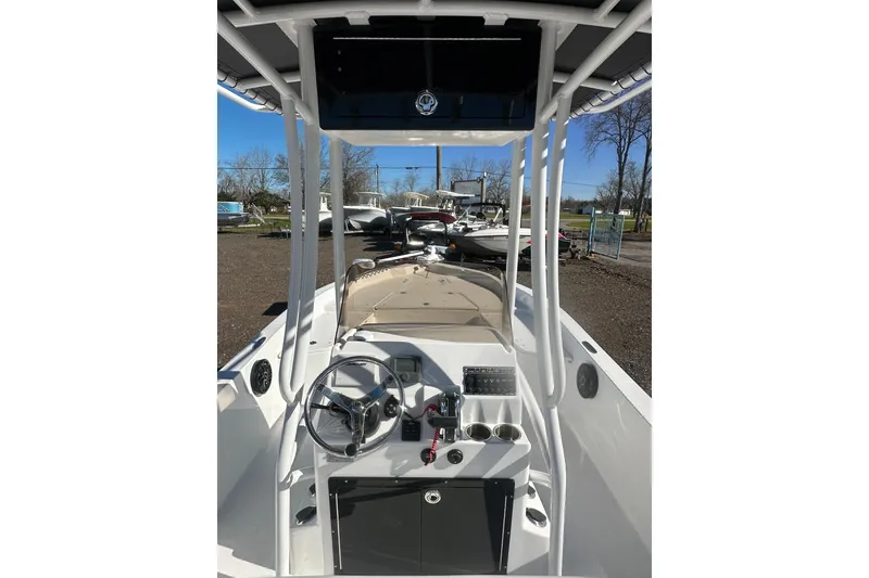 Slide: The Image of 2026 Action Craft 24 Bay boat interior with steering wheel and control panel. - 17
