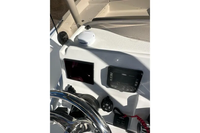 Slide: The Image of 2026 Action Craft 24 Bay boat dashboard with navigation and control systems. - 18