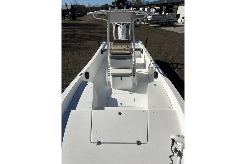 Slide: The Image of 2026 Action Craft 24 Bay boat, white deck, center console, outdoor setting. - 27