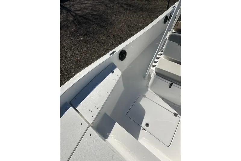 Slide: The Image of 2026 Action Craft 24 Bay boat interior with seating and storage compartments. - 28