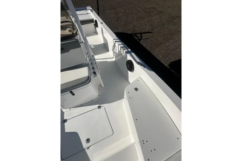 Slide: The Image of 2026 Action Craft 24 Bay boat interior with seating and storage compartments. - 29