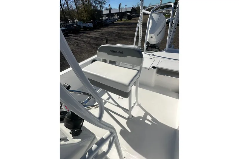 Slide: The Image of 2026 Action Craft 24 Bay boat interior with seating and motor, showcasing sleek design. - 30