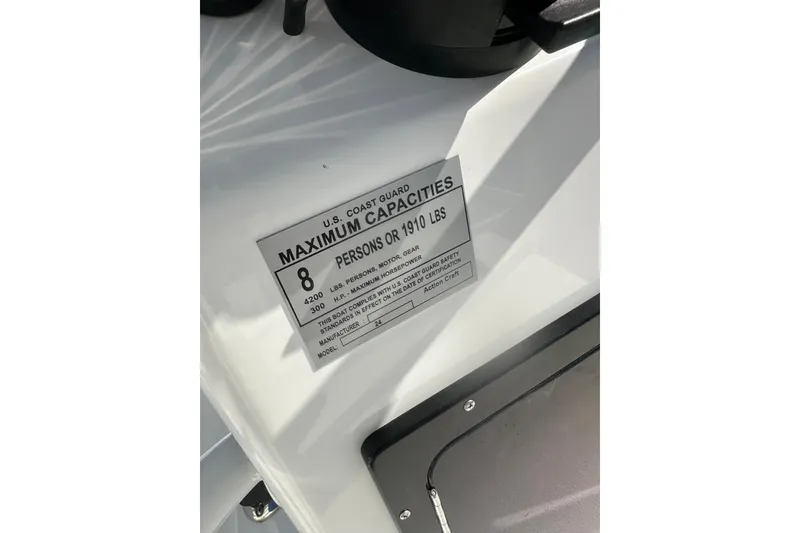 Slide: The Image of 2026 Action Craft 24 Bay boat capacity label, maximum 8 persons or 1910 lbs. - 34