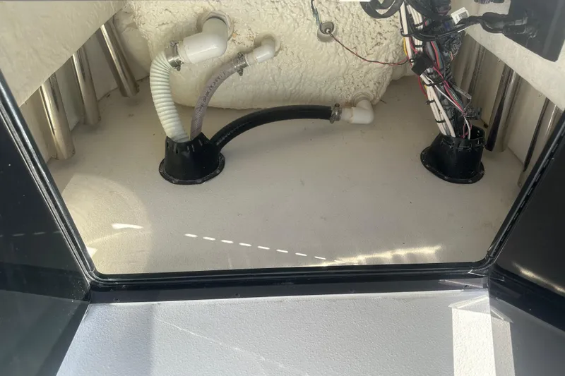 Slide: The Image of Interior view of 2026 Action Craft 24 Bay boat wiring and plumbing. - 36