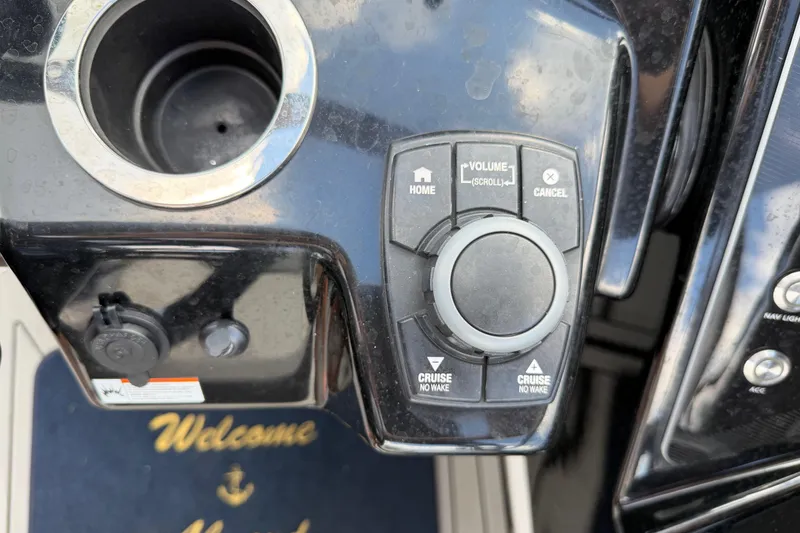 Slide: The Image of Control panel of 2022 Yamaha Boats 252SD with volume and cruise settings. - 17