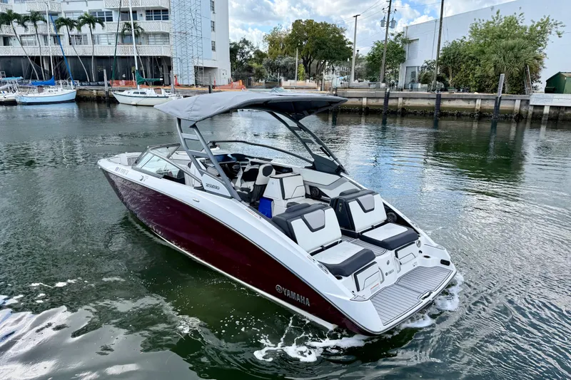 Slide: The Image of 2022 Yamaha Boats 252SD in a marina, featuring sleek design and modern amenities. - 3