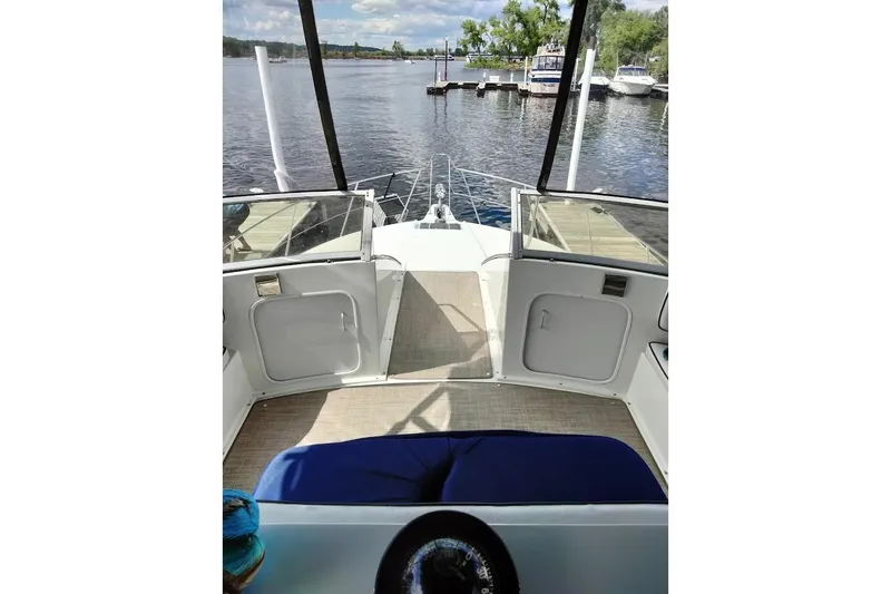 Slide: The Image of 1994 Carver 380 Santego yacht interior with open deck view at marina. - 29