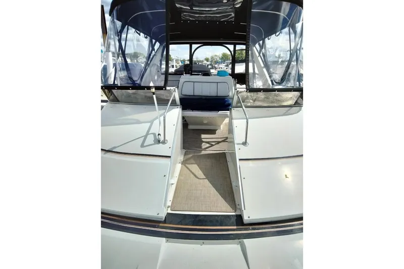 Slide: The Image of 1994 Carver 380 Santego yacht deck with seating and clear canopy. - 30