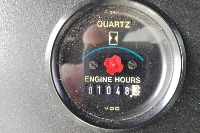 Slide: The Image of Quartz engine hour meter showing 1048.3 hours on a 1994 Carver 380 Santego. - 36