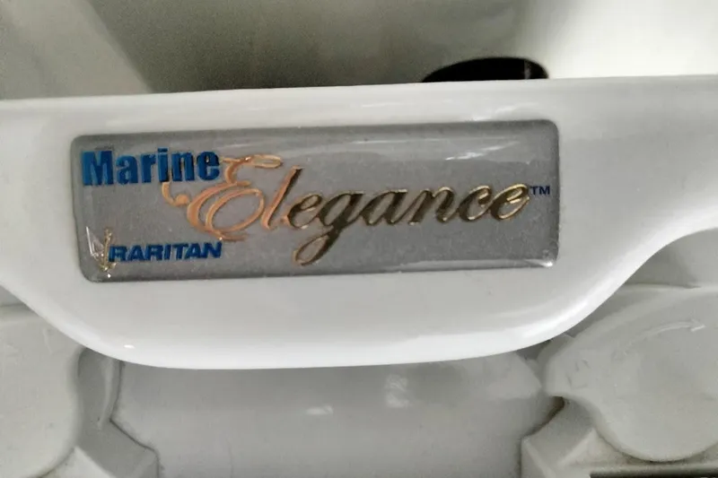 Slide: The Image of Marine Elegance Raritan label on 1994 Carver 380 Santego boat component. - 38