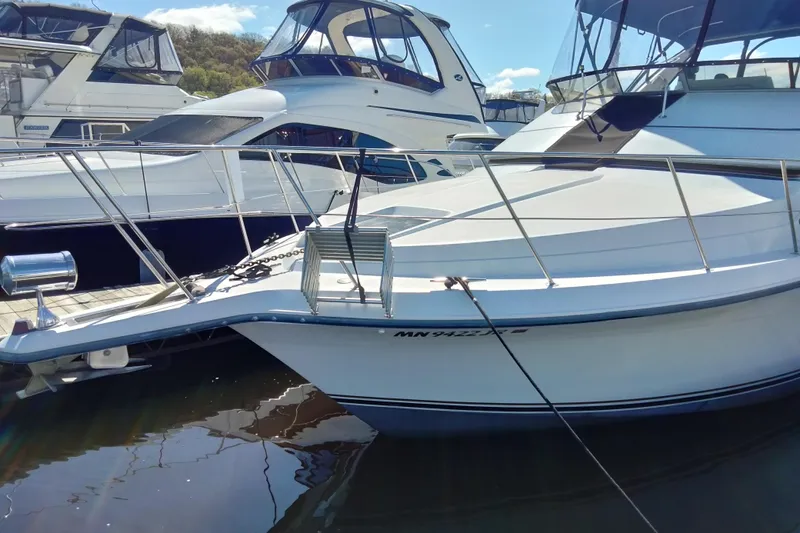 Slide: The Image of 1994 Carver 380 Santego yacht docked at marina, sunny day, clear sky. - 5