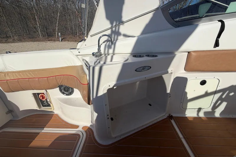 Slide: The Image of 2006 Four Winns 278 Vista boat interior with sink and seating area. - 10