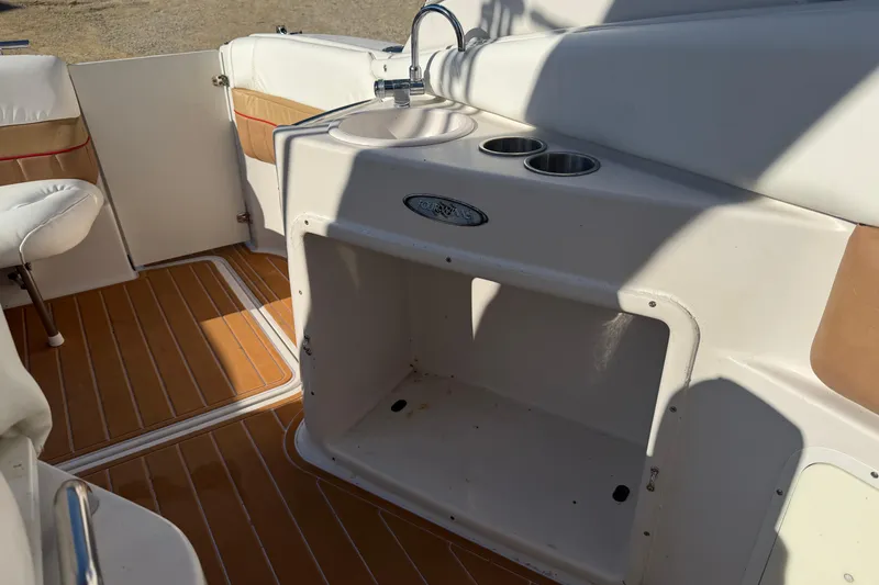 Slide: The Image of 2006 Four Winns 278 Vista boat interior with sink and cup holders. - 11