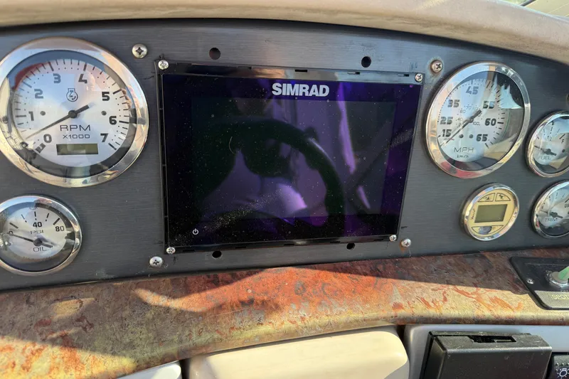 Slide: The Image of Dashboard of 2006 Four Winns 278 Vista boat with Simrad display and gauges. - 14