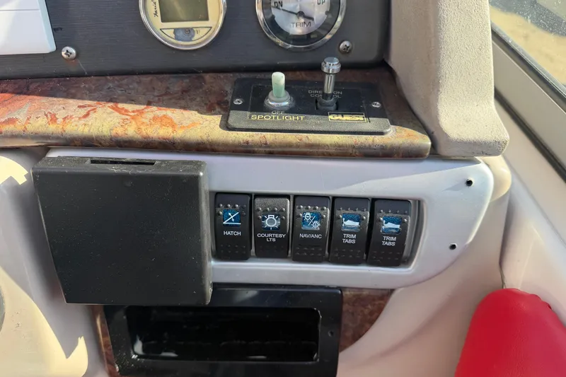 Slide: The Image of Control panel of a 2006 Four Winns 278 Vista boat with switches and gauges. - 16