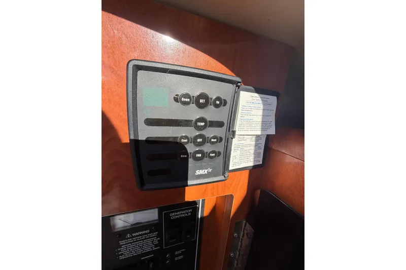 Slide: The Image of Control panel on 2006 Four Winns 278 Vista boat, featuring buttons and instructions. - 23