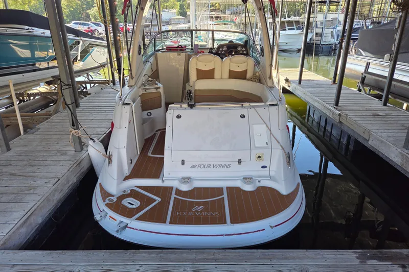Slide: The Image of 2006 Four Winns 278 Vista boat docked in marina, rear view. - 3