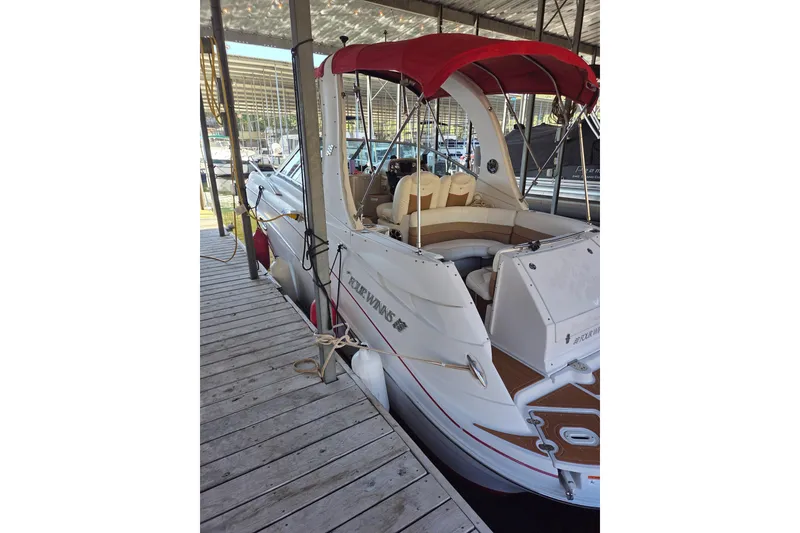 Slide: The Image of 2006 Four Winns 278 Vista boat docked with red canopy and spacious seating. - 4