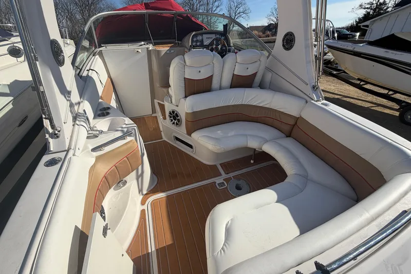 Slide: The Image of 2006 Four Winns 278 Vista boat interior with white and tan seating, wood flooring. - 5