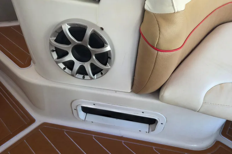 Slide: The Image of 2006 Four Winns 278 Vista boat interior with speaker and cushioned seating. - 7