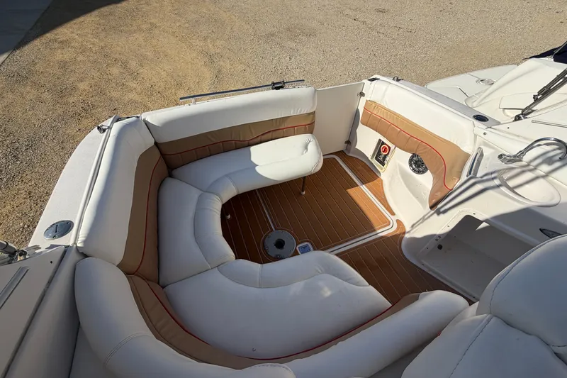 Slide: The Image of 2006 Four Winns 278 Vista boat interior with white seating and wood flooring. - 8