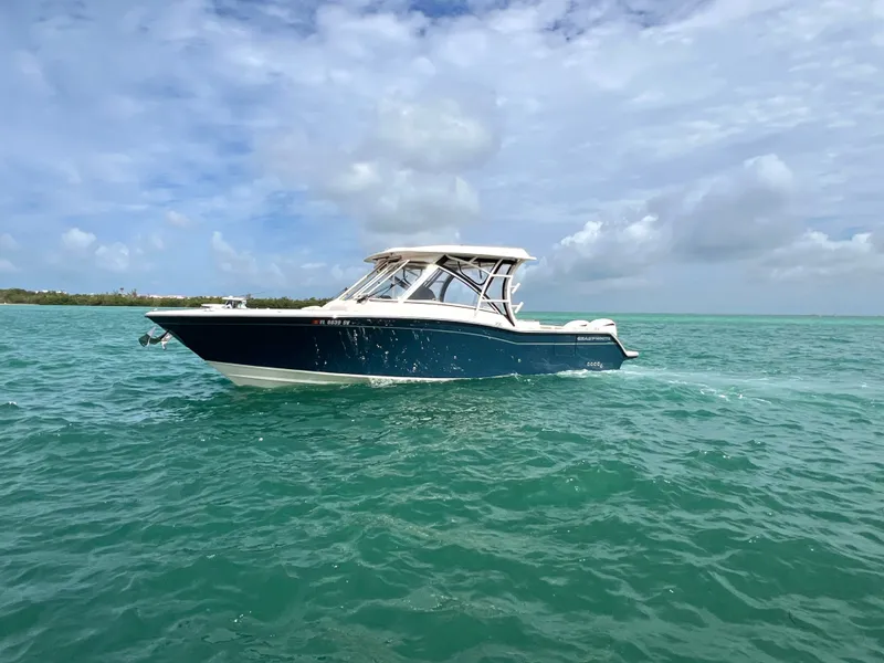 Slide: The Image of Grady-White Freedom 325 boat on open sea, 2021 model. - 2