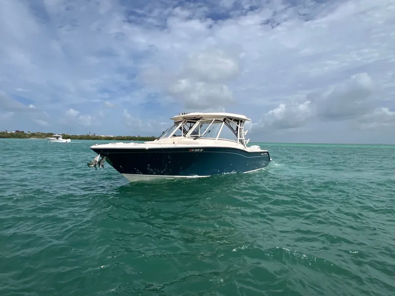 Slide: The Image of 2021 Grady-White Freedom 325 boat on open sea. - 5