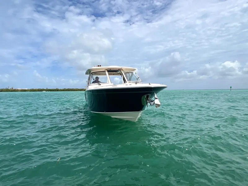 Slide: The Image of Grady-White Freedom 325 boat on open sea, 2021 model. - 7