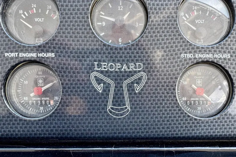 Slide: The Image of Instrument panel of a 2007 Leopard Express Motor Yacht showing engine hours and voltmeters. - 36