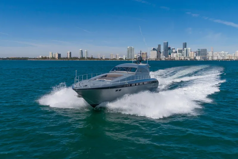 Slide: The Image of 2007 Leopard Express Motor Yacht cruising near city skyline on blue ocean waters. - 5