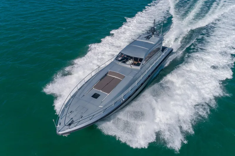Slide: The Image of 2007 Leopard Express Motor Yacht cruising on open water, creating a dynamic wake. - 6